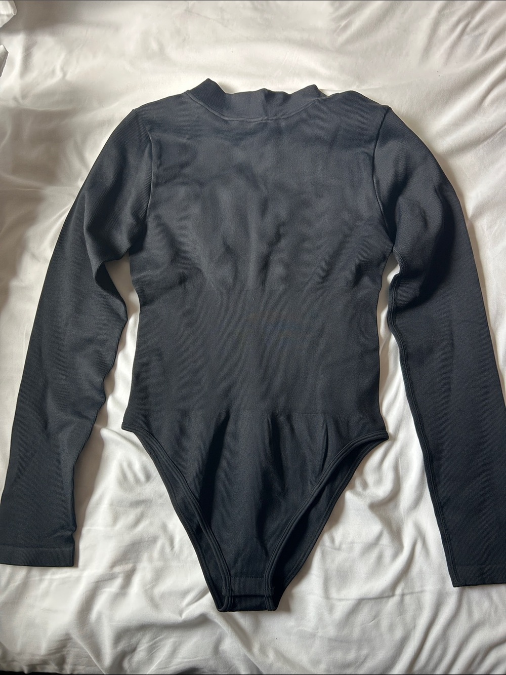 Woman Black Long-Sleeve One-Piece Bodysuit